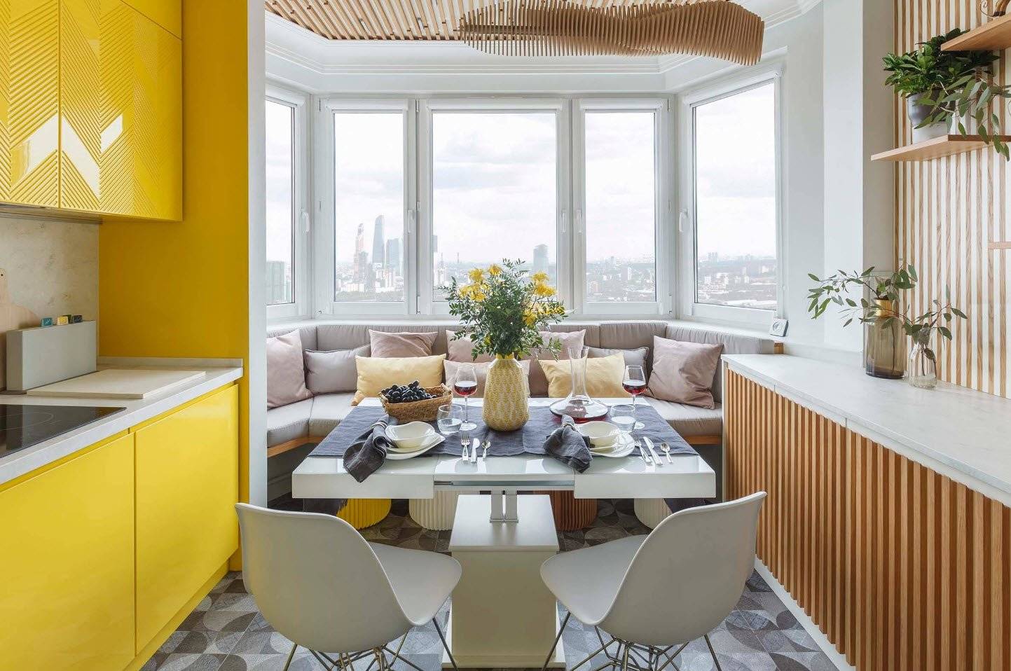 Дизайн кухни 12 кв м в скандинавском стиле с желтым диваном и выходом на балкон