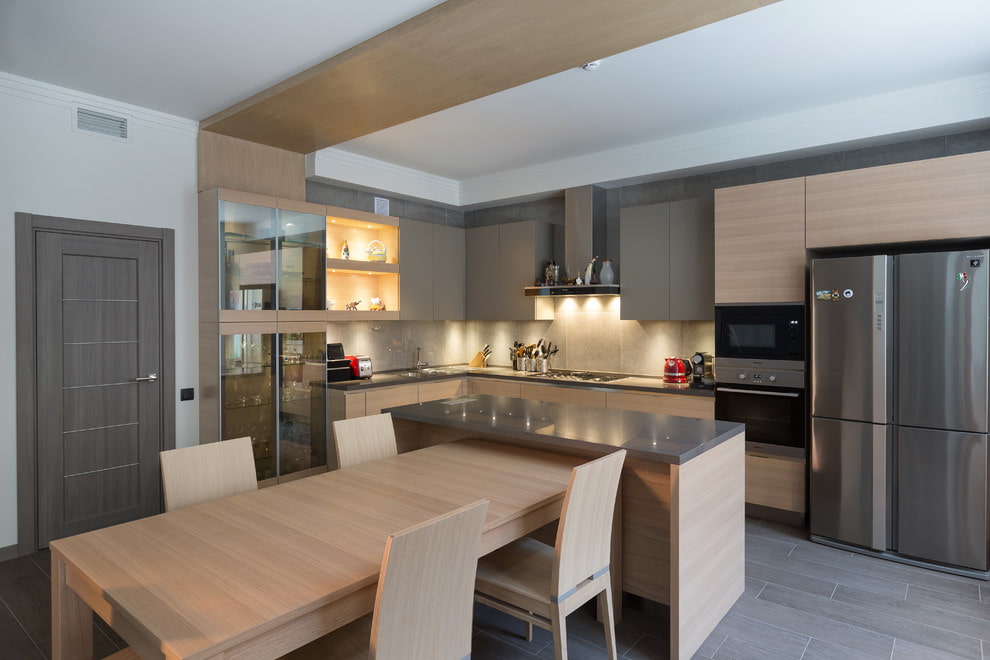 Кухонный остров с обеденным столом, барной стойкой и системой хранения в частном доме: варианты оформления в современном стиле
 - 26 фото